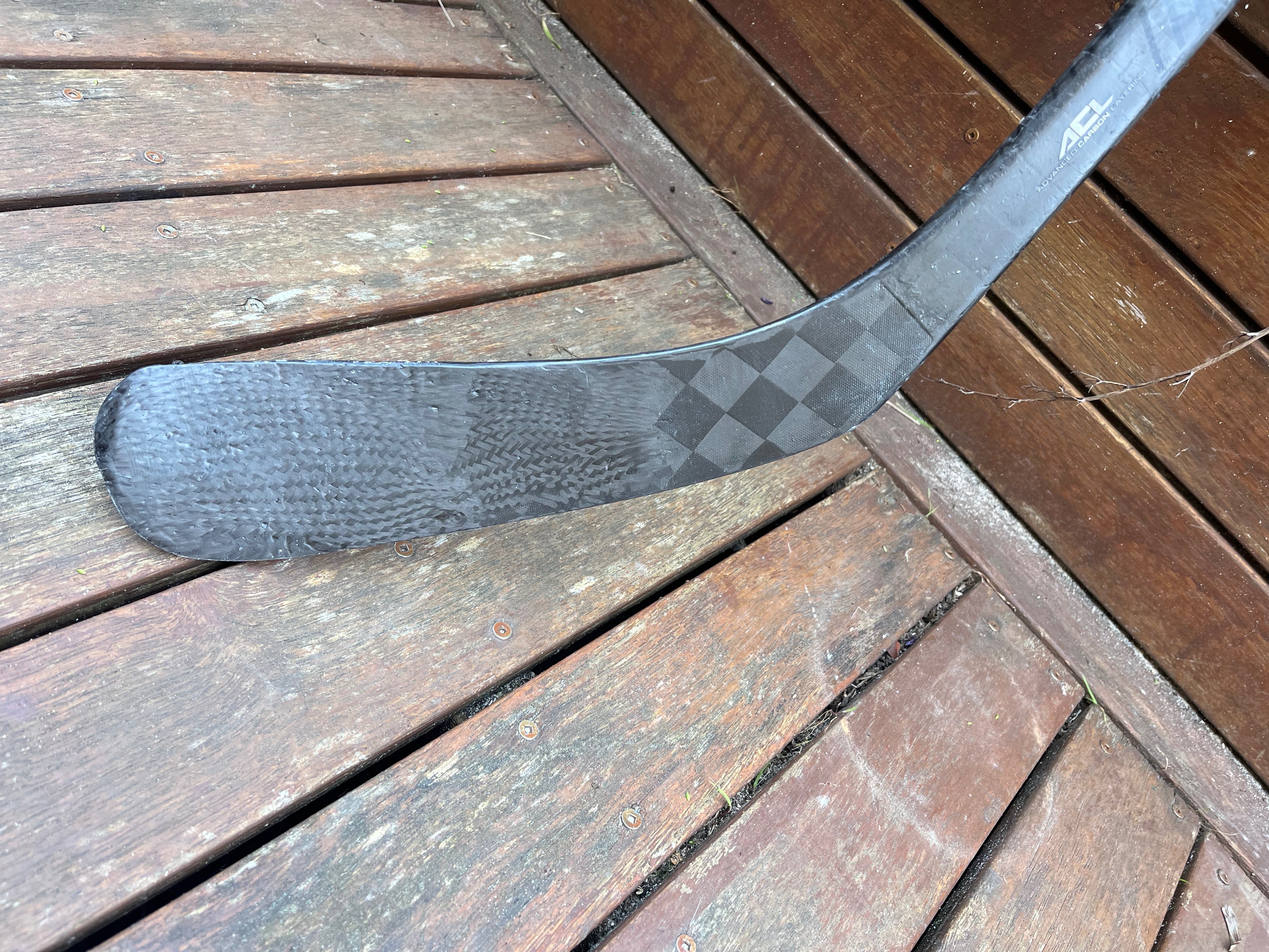 Repaired blade showing new carbon weave across the face