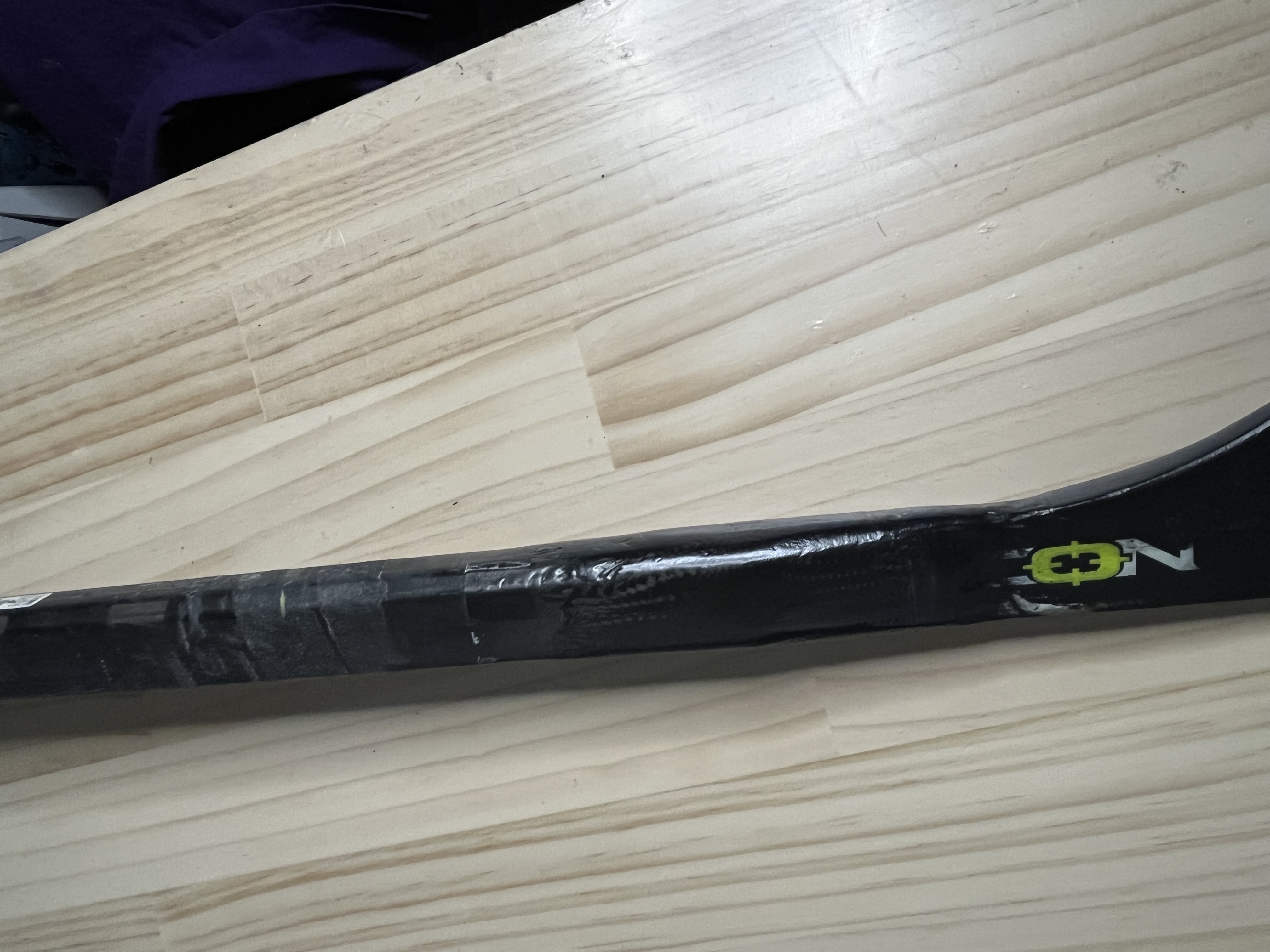 Close-up of the carbon-wrapped joint where the new blade meets the shaft